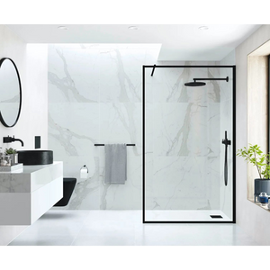 Modern bathroom featuring Flair AYO 8mm wetroom panel with matte black frame and clear glass, marble-effect wall tiles, black round sink, circular mirror, towel rail and rainfall showerhead in contemporary minimalist design