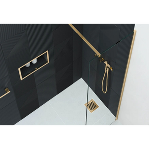 Modern luxury bathroom wetroom shower enclosure featuring Flair AYO 8mm glass panels with brushed brass frame, black textured wall tiles, white floor, integrated rainfall showerhead and handheld shower system, recessed shelf niche and floor drain