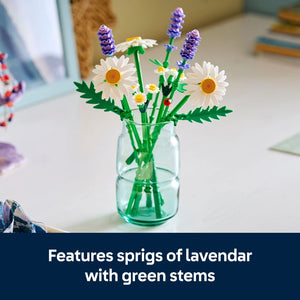 LEGO buildable flower arrangement featuring white daisies with yellow centers and purple lavender sprigs with green stems displayed in a clear glass vase on a white desk