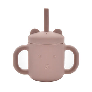 Pink silicone sippy cup with bear ears design, dual handles, and drinking straw for toddlers