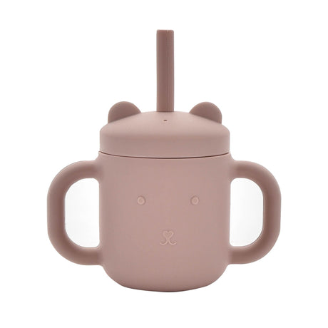Pink silicone sippy cup with bear ears design, dual handles, and drinking straw for toddlers