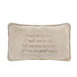 Decorative pillow with embroidered text on a white background