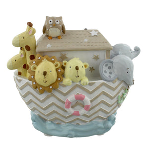 Decorative toy Noah's Ark with animal figures on a white background