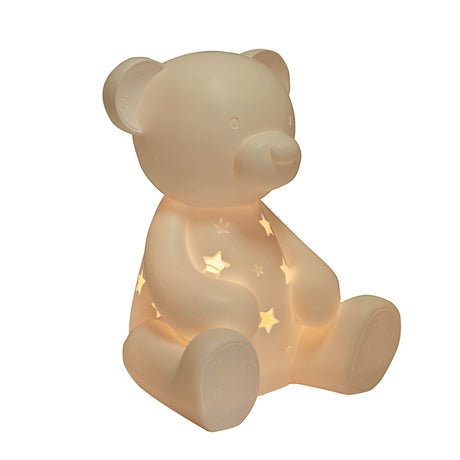 Light-up teddy bear with star designs on a white background