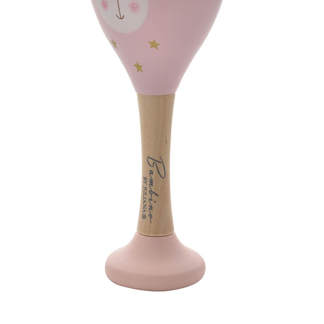 Bambino wooden maraca with pink cone-shaped head featuring a smiling face and gold stars, natural wood handle with branding, and pink base