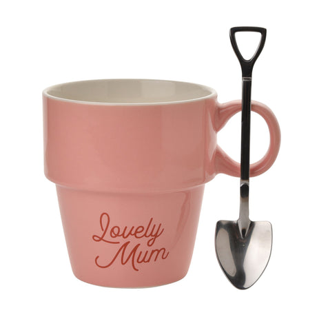 Pink mug with 'Lovely Mum' text and a metal shovel on a white background
