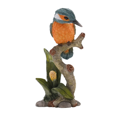Decorative bird figurine perched on a branch with leaves on a white background