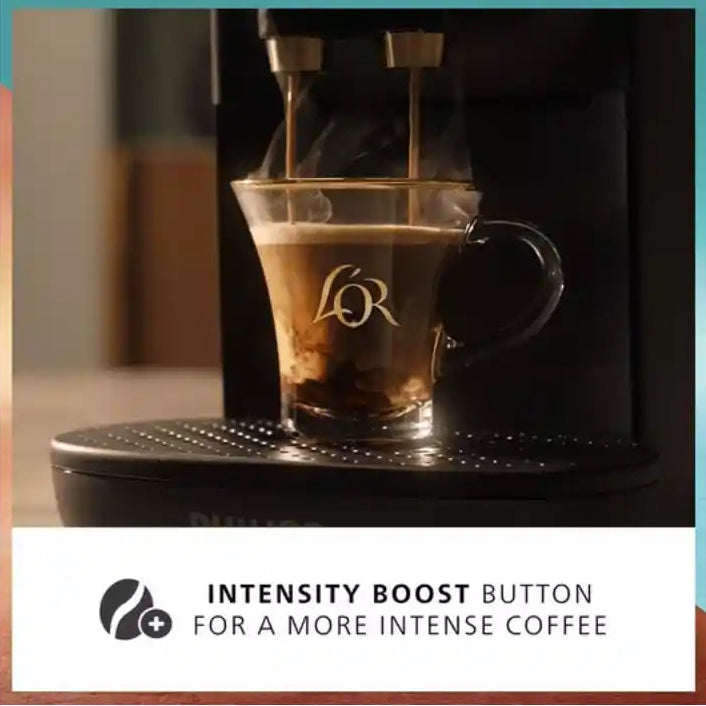 Philips L'OR Barista Absolu black coffee machine dispensing espresso into branded glass cup with intensity boost button feature highlighted below