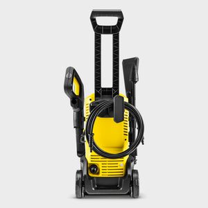 Kärcher K3 Eco!Booster yellow and black pressure washer with coiled hose, spray gun and adjustable nozzle on wheels against white background