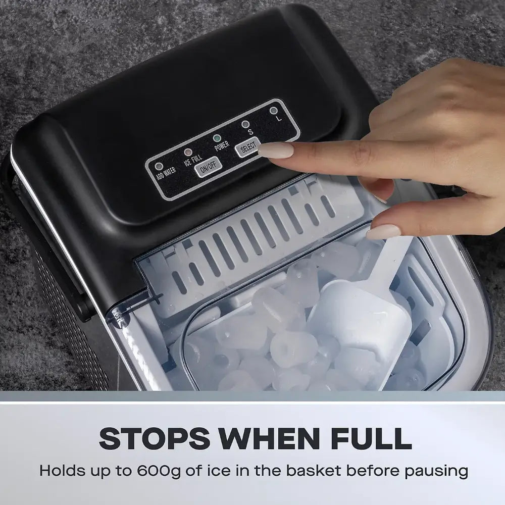 Daewoo portable ice cube maker machine with black and stainless steel finish showing control panel with buttons and transparent ice basket containing white ice cubes, demonstrating full capacity feature