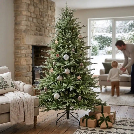 7.5ft Puleo Arcadia Pine artificial Christmas tree decorated with cream and gold ornaments and star toppers in a modern living room with fireplace and wrapped gifts