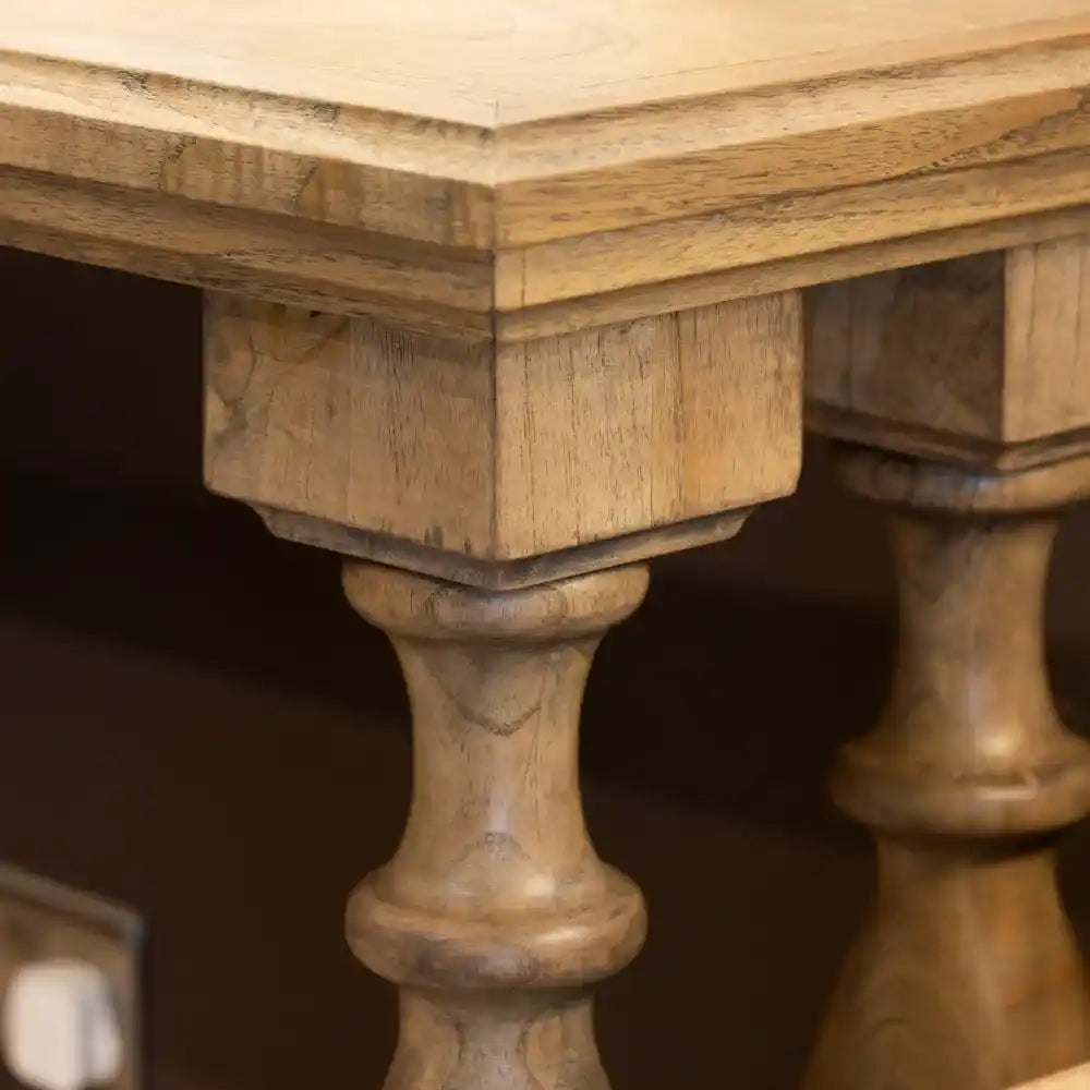 Close-up detail of natural wood console table showing turned wooden pillar leg and beveled edge top in light oak finish, Tara Lane Pillars Console Table 120cm