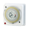 White 24-hour mechanical time switch with yellow dial ring, analog clock face showing 12-hour time markings, red power indicator light, and mounting holes for wall installation