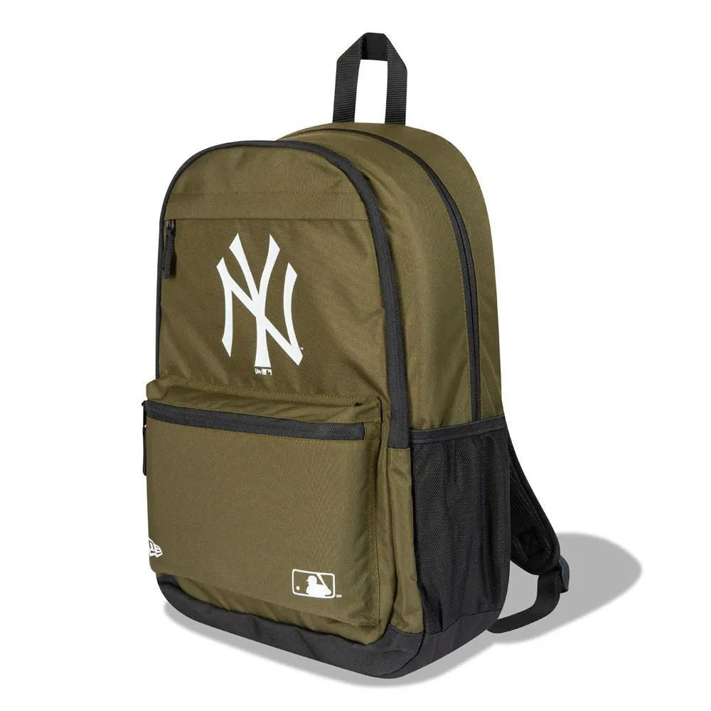 New Era New York Yankees backpack in olive green and black with white NY logo, 17 litre capacity, featuring front zippered pocket and mesh side panels