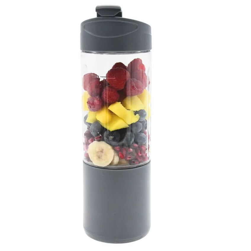 Urban Fitness VitalFuse portable blender in grey with dark cap containing layered fresh fruits including raspberries, pineapple, blueberries and banana slices