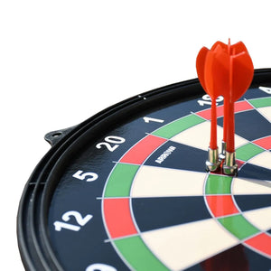 Close-up of a magnetic dartboard with red darts lodged in the center, featuring a black frame, colored segments in navy blue, red, green and cream, and numbered scoring rings from 2 to 20