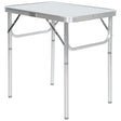 Trespass portable folding camping table with aluminum frame and white surface top, featuring collapsible legs and black braces for compact storage