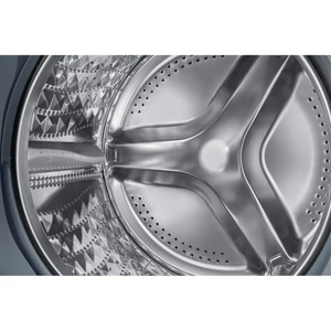 Close-up interior view of Samsung Series 5 washing machine drum showing stainless steel construction with perforated holes and curved blade design in white finish