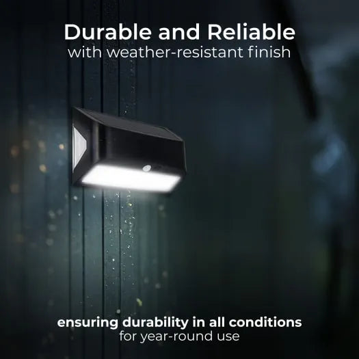 Black Luceco Prysm solar LED wall light with PIR sensor mounted on dark textured wall in rain, emitting bright white light, demonstrating weather-resistant durability for outdoor use