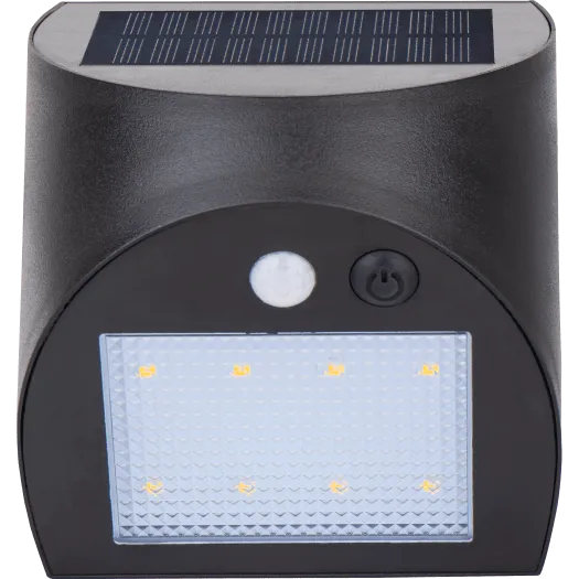 Luceco Prysm black outdoor solar LED wall light with PIR motion sensor, featuring rectangular frosted diffuser with eight amber LED lights, power button and motion sensor indicator, mounted on cylindrical dark grey body with solar panel on top