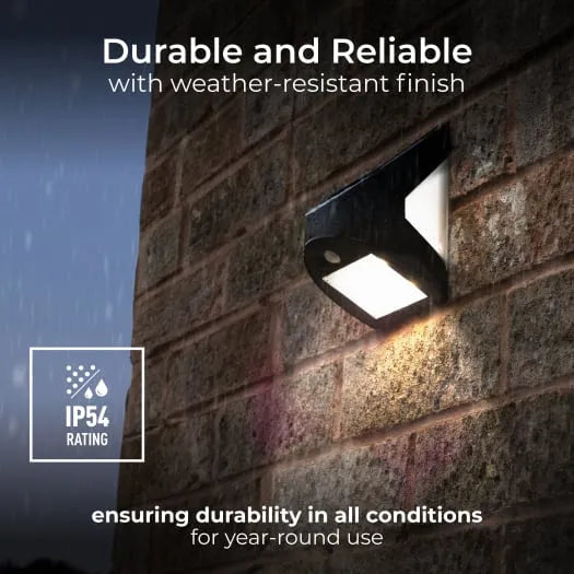 Luceco Prysm black solar powered LED wall light with PIR sensor mounted on brick wall at dusk, showing bright white illumination and IP54 weather-resistant rating badge