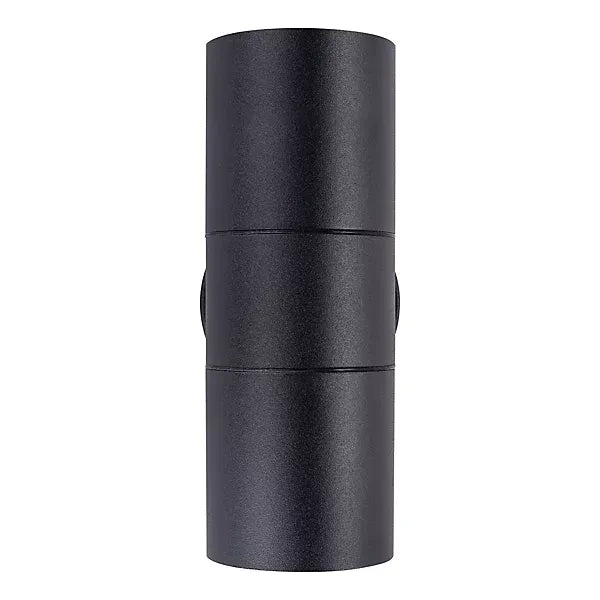 Black cylindrical stainless steel up down wall light with segmented body sections and side apertures for external outdoor lighting