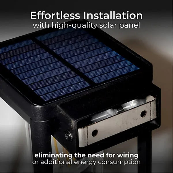 Close-up of a black solar wall lantern showing the blue solar panel on top and mounting bracket below, highlighting effortless installation without wiring requirements
