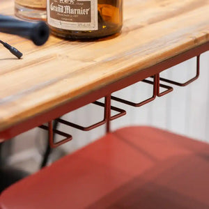 Red metal Vespa scooter-shaped wine rack with natural wood top holding Grand Marnier bottle, featuring curved tubular frame design and multiple bottle holders