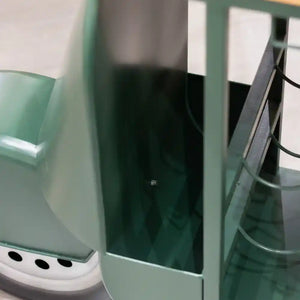 Green metal Vespa scooter-shaped wine rack with white base, featuring three bottle holders and glass shelving, displayed against white background