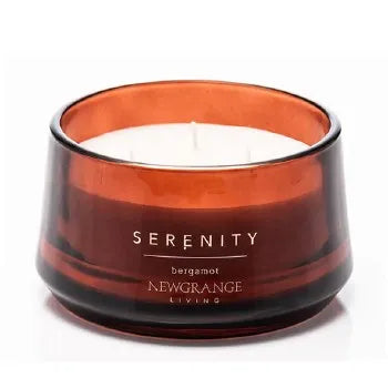 Serenity Bergamot luxury scented candle by Newgrange Living in amber glass jar with white wax and black rim