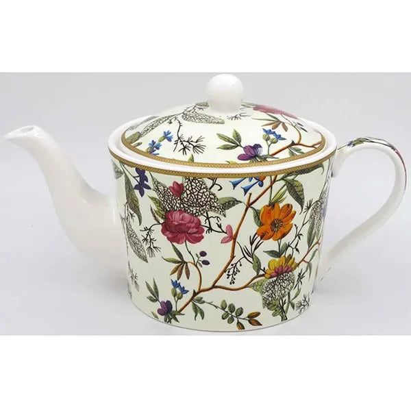 William Kilburn fine bone china teapot with cream background and multicolored botanical floral design featuring roses, berries and green foliage with gold trim and white finial lid