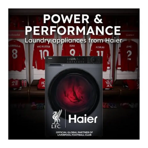 Haier washing machine advertising image showing a dark grey front-load washer with red glowing drum, displayed against Liverpool FC jersey background with players' shirts, featuring "Power & Performance" headline and LFC official global partner branding