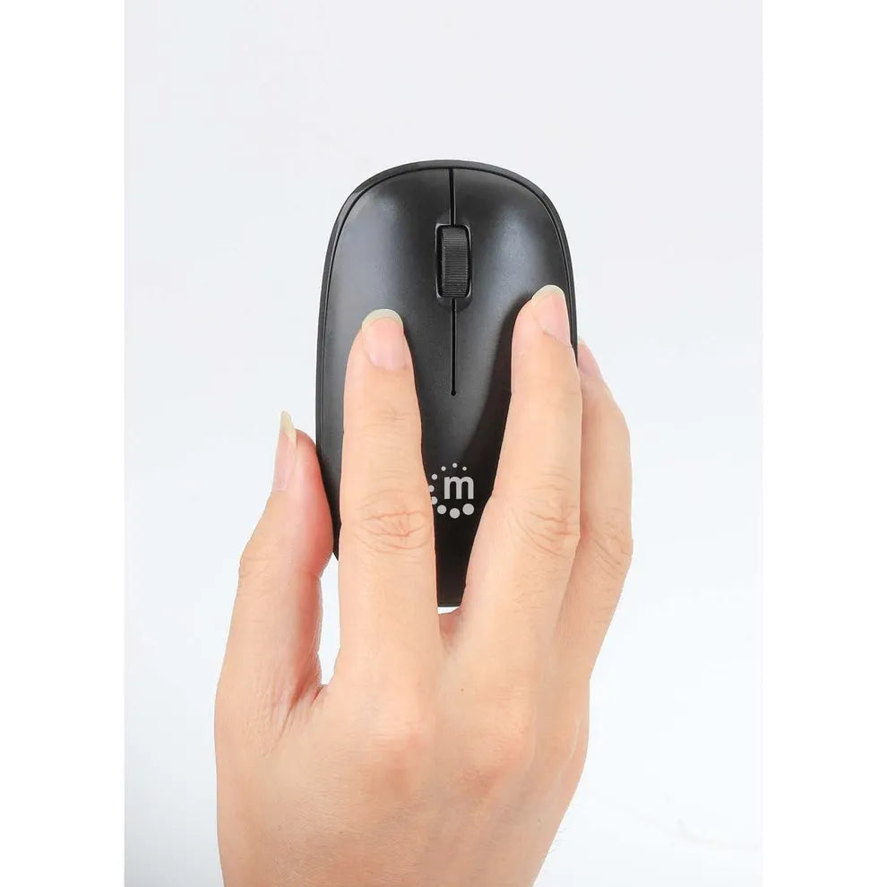 Hand holding black Manhattan wireless optical mouse with scroll wheel, showing top view with logo and center button detail against white background