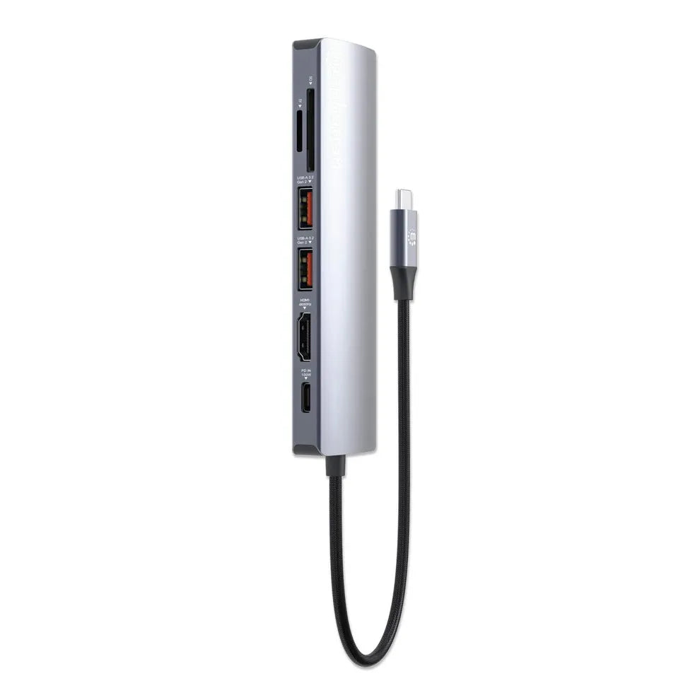 Manhattan USB-C 7-in-1 docking station in silver and dark gray with attached braided USB-C cable, featuring multiple ports including HDMI and USB connections on vertical housing