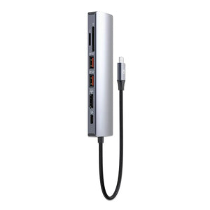 Manhattan USB-C 7-in-1 docking station in silver and dark gray with attached braided USB-C cable, featuring multiple ports including HDMI and USB connections on vertical housing