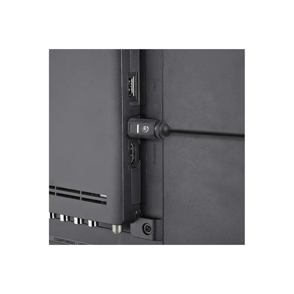 Black digital optical audio cable with Toslink connectors attached to electronic equipment showing cable management and connection detail