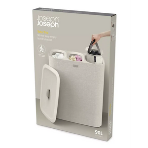 Joseph Joseph Tota Trio 90-litre easy-empty laundry basket in ecru with removable dividers and carry handles, shown with lid open displaying compartments for sorted laundry
