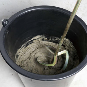 Black Bihui Spiral Mixer M14 with grey dough mixture and metal spiral attachment inside stainless steel bowl during mixing operation