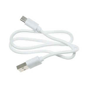 White USB charging cable with micro-USB connector and standard USB-A plug end coiled on white background