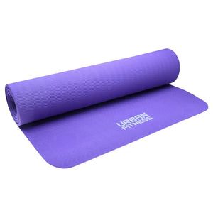 Purple 6mm yoga mat by Urban Fitness partially rolled showing textured surface and brand logo on flat section