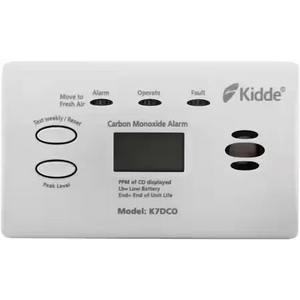 Kidde K7DCO carbon monoxide alarm with white plastic casing, digital display showing PPM of CO levels, battery status indicator, and control buttons for alarm test, reset, and silence functions