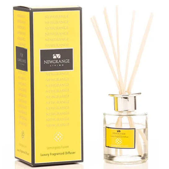 Newgrange Living luxury lemongrass reed diffuser 100ml with yellow branded box packaging and clear glass bottle containing pale wooden diffuser sticks