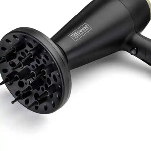 Black TRESemmé Salon Professional 2200W hairdryer with attached black diffuser attachment shown against white background