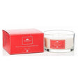 Newgrange Living Festive Spice luxury scented candle 3 wick in clear glass container with red branded label next to bright red product box packaging