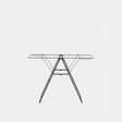 Black metal winged clothes airer with extended horizontal drying bars and folding tripod legs, front view against white background