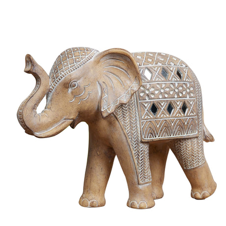Decorative elephant figurine with intricate patterns on a white background