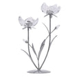 Decorative candle holder with flower design on a white background