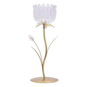 Hestia single stem candle holder featuring a clear glass tulip-shaped bloom with decorative beading on a brushed gold metal stem and circular base with leaf accents