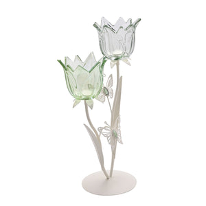 Hestia two stem candle holder featuring green and clear glass tulip-shaped cups with decorative butterflies on matte off-white metal base and stems