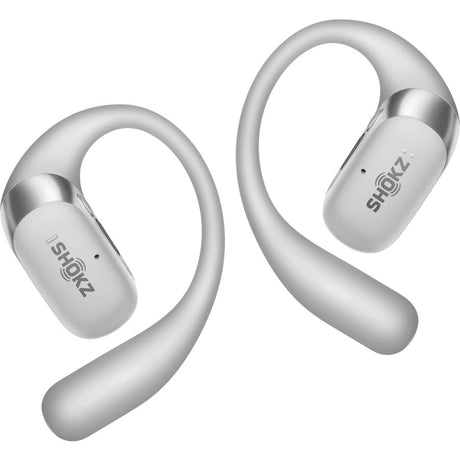 Shokz OpenFit 2+ open ear wireless earbuds in grey with silver accents, showing pair of earbuds with curved over-ear hook design and white earbud pods displaying Shokz branding